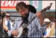 A person playing a banjo

Description automatically generated