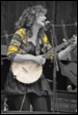 A person playing a banjo

Description automatically generated