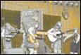 A group of people playing instruments

Description automatically generated