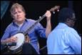 A person playing a banjo

Description automatically generated