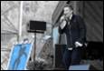 A person singing into a microphone

Description automatically generated