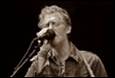 A person singing into a microphone

Description automatically generated