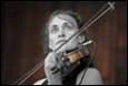 A person playing a violin

Description automatically generated