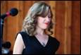 A person in a black dress

Description automatically generated