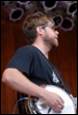 A person holding a guitar

Description automatically generated