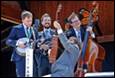 A group of musicians playing instruments

Description automatically generated