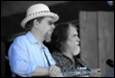 A person and person in hats

Description automatically generated