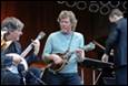 A group of people playing instruments

Description automatically generated