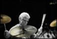 A person playing the drums

Description automatically generated