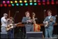 A group of people playing instruments

Description automatically generated