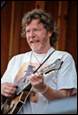 A person playing a guitar

Description automatically generated