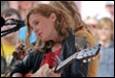 A person playing a guitar

Description automatically generated