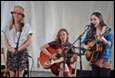 A group of women playing instruments

Description automatically generated