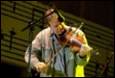 A person playing a violin

Description automatically generated