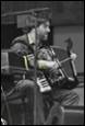 A person playing an instrument

Description automatically generated