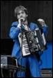 A person playing an accordion

Description automatically generated