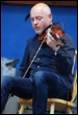 A person playing a violin

Description automatically generated