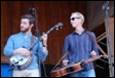 A group of men playing instruments

Description automatically generated