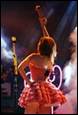 A person in a dress on stage

Description automatically generated