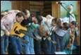 A group of people playing instruments

Description automatically generated
