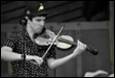 A person playing a violin

Description automatically generated