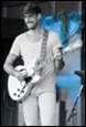 A person playing a guitar

Description automatically generated