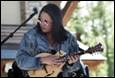A person playing a guitar

Description automatically generated