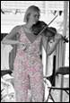 A person playing a violin

Description automatically generated