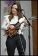 A person playing a guitar

Description automatically generated