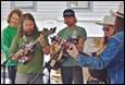 A group of people playing instruments

Description automatically generated