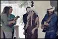A group of people playing instruments

Description automatically generated