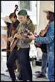 A group of people playing instruments

Description automatically generated