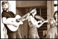 A group of people playing instruments

Description automatically generated
