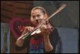 A person playing a violin

Description automatically generated