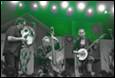 A group of people playing instruments

Description automatically generated