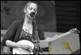 A person playing a guitar

Description automatically generated