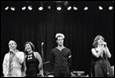 A group of people on a stage

Description automatically generated