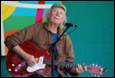 A person playing a guitar

Description automatically generated with medium confidence