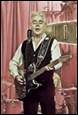 A person playing a guitar

Description automatically generated with medium confidence