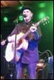 A person playing guitar on stage

Description automatically generated with low confidence