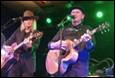 A person and person playing guitars on a stage

Description automatically generated with low confidence