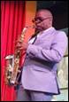 A person playing a saxophone

Description automatically generated with medium confidence