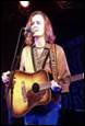 A person holding a guitar

Description automatically generated with medium confidence