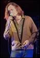 A person singing into a microphone

Description automatically generated
