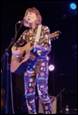 A person playing guitar on stage

Description automatically generated with low confidence