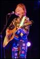 A person playing guitar and singing

Description automatically generated with low confidence