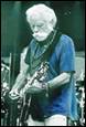 A person with a white beard playing a guitar

Description automatically generated with low confidence
