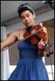 A person playing a violin

Description automatically generated with medium confidence