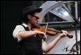 A person playing a violin

Description automatically generated with medium confidence