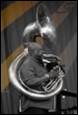 A person playing a french horn

Description automatically generated with medium confidence